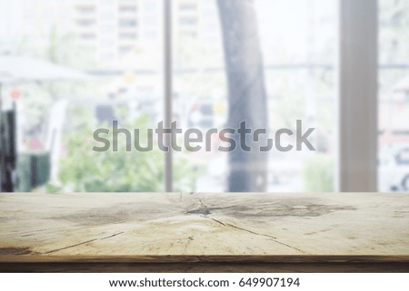 Close up of empty wooden desk on outdoor background. Advertisement concept