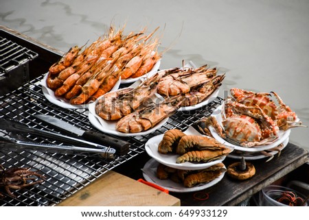 Amphawa grilled Seafood on boat Royalty-Free Stock Photo #649933129