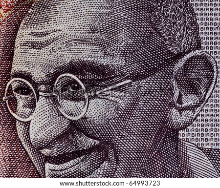 Close up of Indian Rupee- Smiling Gandhi Royalty-Free Stock Photo #64993723