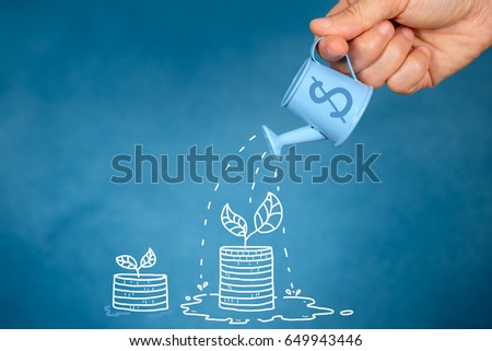 Hand with watering can pouring  to growing tree, Savings concept, Financial planning to grow.