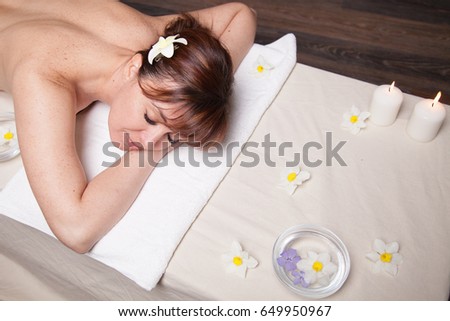 the beautiful girl lying in Spa massage sauna Royalty-Free Stock Photo #649950967