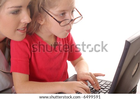 little girl checking emails with mom