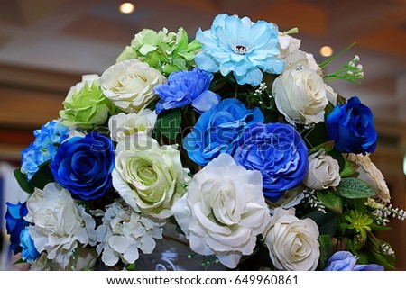 Artificial bouquet colorful of Rose flower decor in wedding ceremony. Selective focus and shallow depth of field.