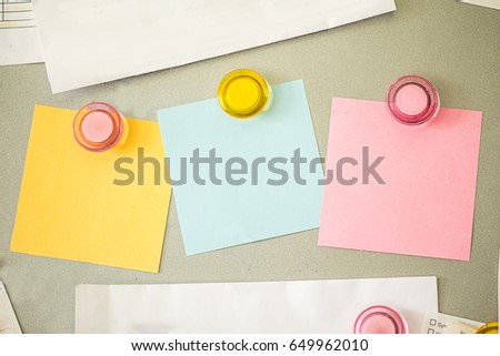 blank colorful note pad on magnetic board for message or memo to reminder.