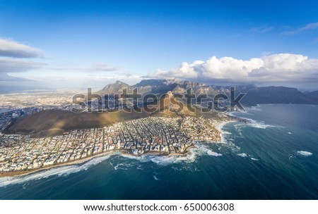Aerial Cape Town views of Seapoint, Lionshead and Tablemountain Royalty-Free Stock Photo #650006308