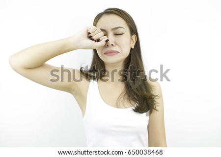 Crying with unhappy sad face, pose by lifestyle of asian beautiful woman portrait in casual dress looking front, standing and thinking negative in grey background.