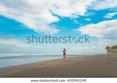 Happy girl by the ocean