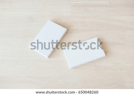 Blank business cards mockup, white business cards on wooden background.