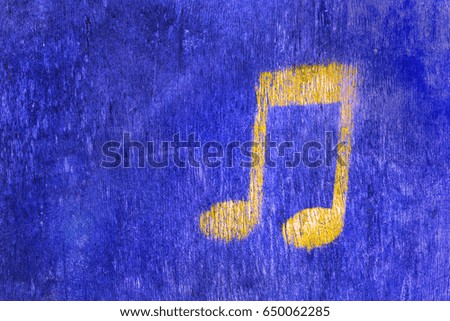 blue wood texture background with a musical yellow sign
