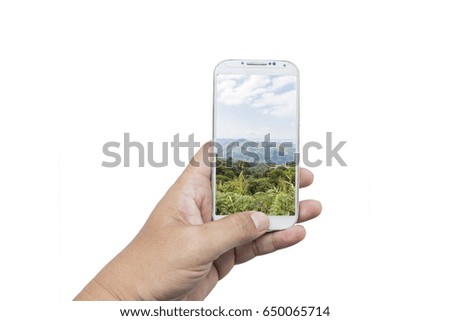 Male hand using his smart phone for searching the travel information of beautiful mountain in Thailand