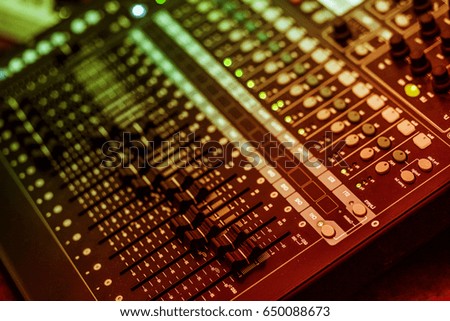  WARNING: SHALLOW DEPTH OF FIELD (small aperture effect) audio a mixing console is an electronic device for combining, routing, and changing the volume level, timbre (tone color)