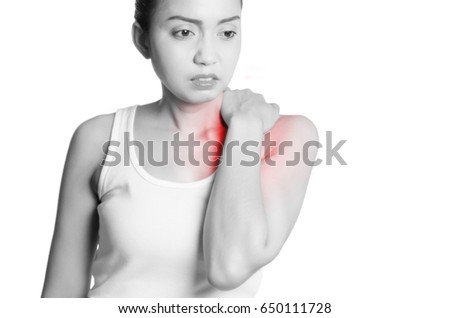young women holding her shoulder in pain. isolated on white background. monochrome photo with red as a symbol for the hardening.