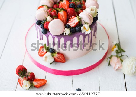 Colorful Ornate Cake with Macaron and strawberry