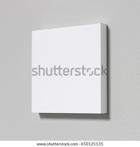 White picture frame on cement wall. Modern gallery in simple style.