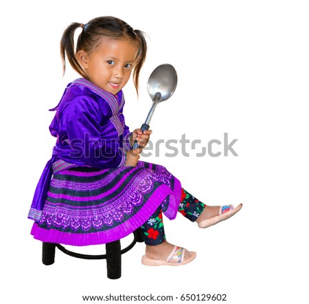 Little girl hold a ladle.