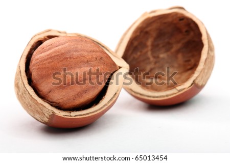 Hazelnut in cracked nutshell Royalty-Free Stock Photo #65013454