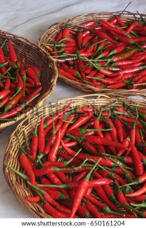 Red chili peppers on woven native basket