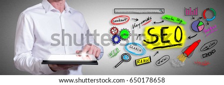 Man using a tablet with seo concept
