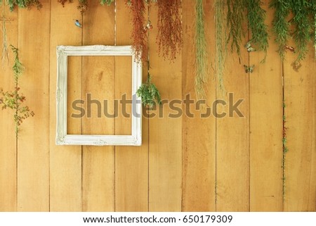 Wooden background with white frame 