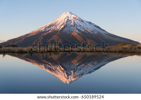 Beautiful reflection mountain and blue lake, Taranaki, New Zealand.  Royalty-Free Stock Photo #650189524