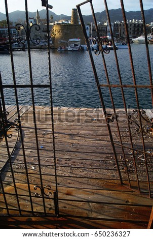 An old, rusty door that opens to the pier in Cyprus Harbor. January 2010.