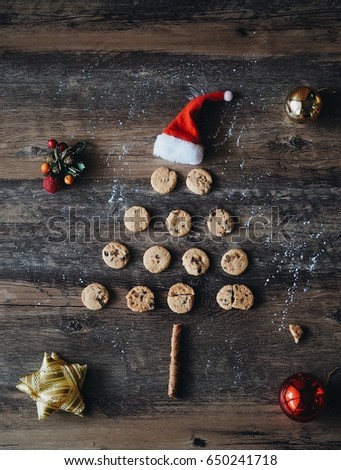 Christmas Gingerbread cookies in the shape of Christmas tree on the wooden texture background