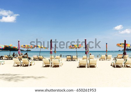 Seascape, picture of beach chairs and beach umbrellas (booth up color process)