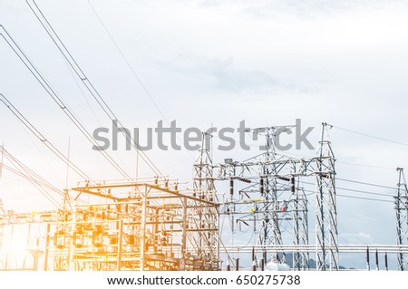 Green energy concept, Electricity station, Electricity plant landscape over blue sky. Part of high-voltage substation with switches and disconnectors.