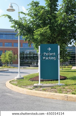 Patient Parking Sign. A sign pointing to the patient parking lot on a metropolitan hospital campus