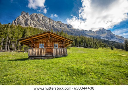 Wooden Swiss chalet in Swiss Alps near Kandersteg and Oeschinnensee, Canton Bern, Switzerland, Europe.