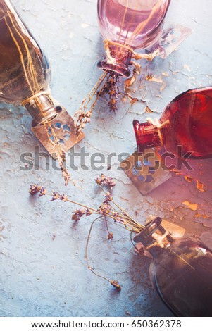 Colorful glass bottles with dry lavender