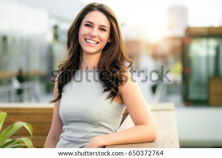 Casual smiling laughing lifestyle of single female, natural look healthy skin and perfect teeth Royalty-Free Stock Photo #650372764