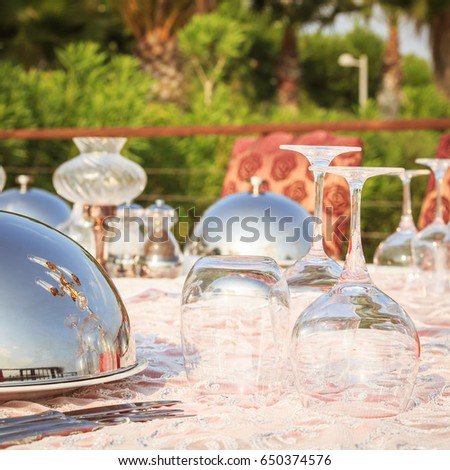 Special occasion table setting in a luxury outdoor restaurant. Festive celebration background. Square