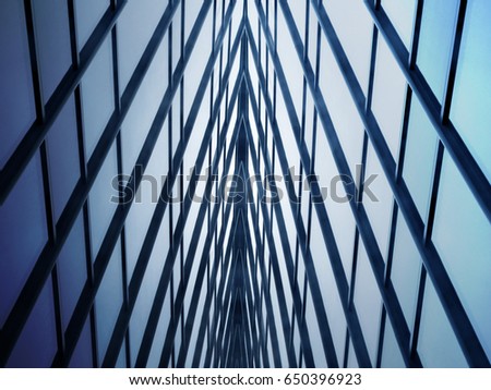 Sky visible through glass roof / ceiling with metal framework. Transparent modern architecture. Structural glazing. Abstract background image on the subject of business or technology