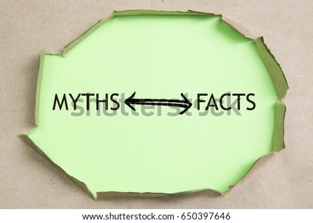 The text Facts vs myths appearing behind torn brown paper