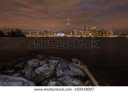 The emblematic CN tower of toronto with cloud skyline cityscape at sunset, ontario canada