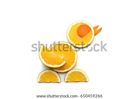 Food art creative concepts. Cute duck made of fruits and vegetables, such as orange, mango and carrots isolated on a white background