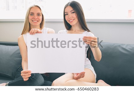 Hold an empty white poster