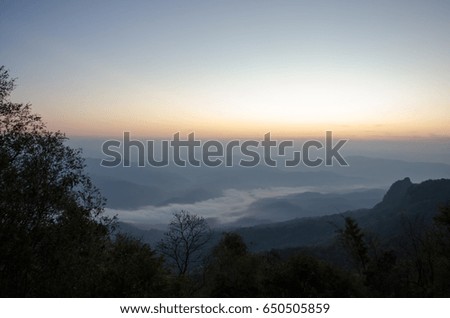 sunrise mountain and mist