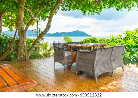 Outdoor patio with empty chair and table
