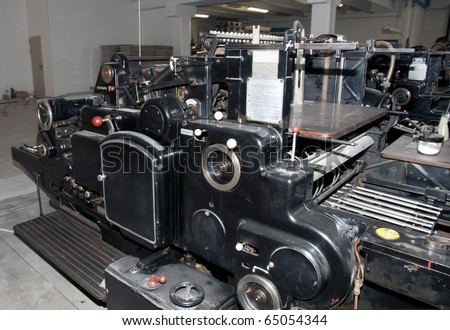 Old print finishing machine in printshop
