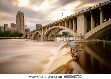 Rushing waters of the Mississippi River and the Third Avenue bridge