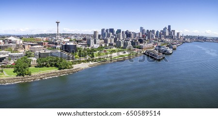 Panoramic Helicopter View of Seattle, Washington Waterfront on Sunny Summer Day with Skyline of Buildings