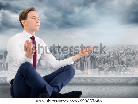 Digital composite of Business man with meditating against grey skyline and clouds