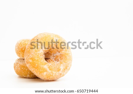 mini donuts sugar,sweet pieces of sugar doughnuts on white background, Copy space Royalty-Free Stock Photo #650719444