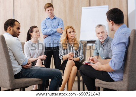 Nice pleasant people participating in the group discussion Royalty-Free Stock Photo #650721643