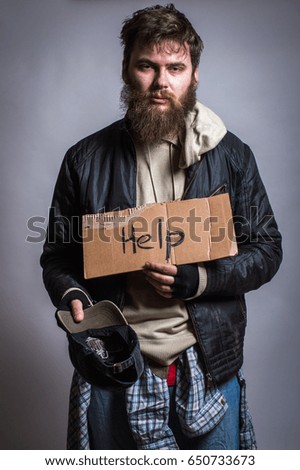 Homeless man with a sign in his hands