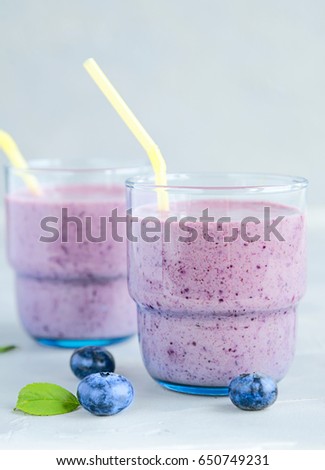 Fresh and Cold Smoothie with Blueberry Banana Milk and Honey Healthy Drink Closed Up View