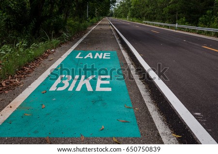 Bicycle road sign on asphalt in Thailand. Bicycle lane.