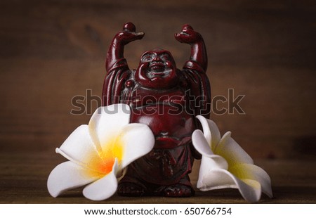 Buddha statue on a wooden background